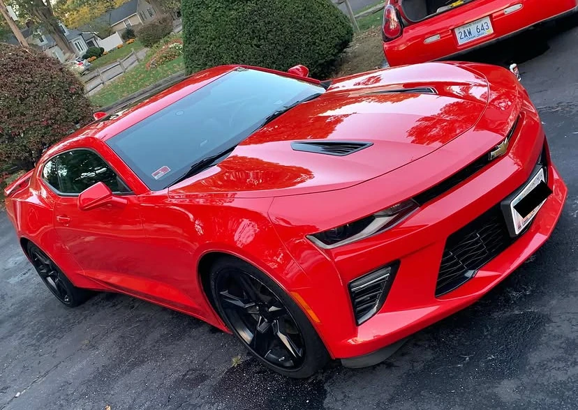 Glossy red Chevrolet Camaro detailed by Peak Shine