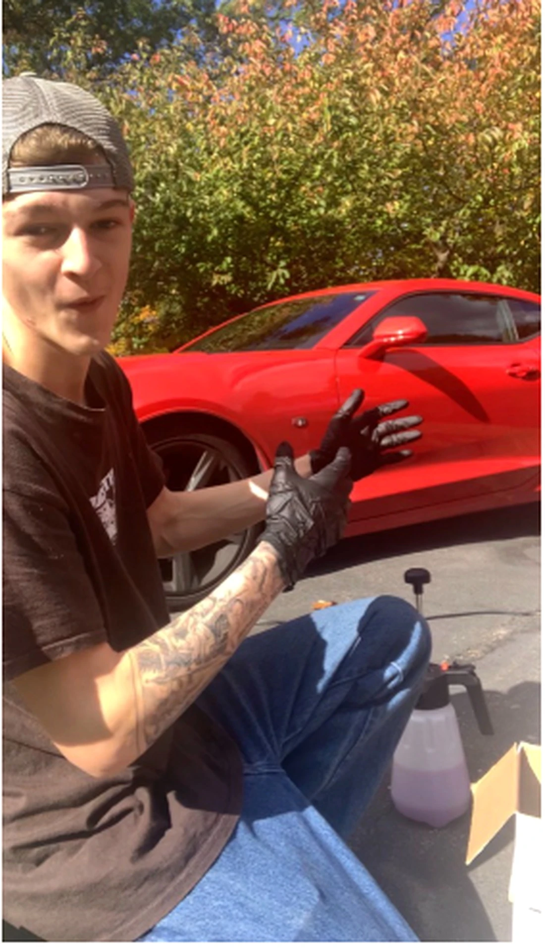 Peak Shine owner detailing a red car